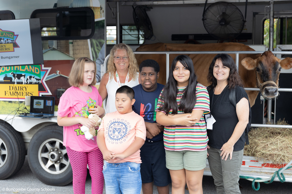Students and teachers standing in front of the Mobile Dairy Classroom.