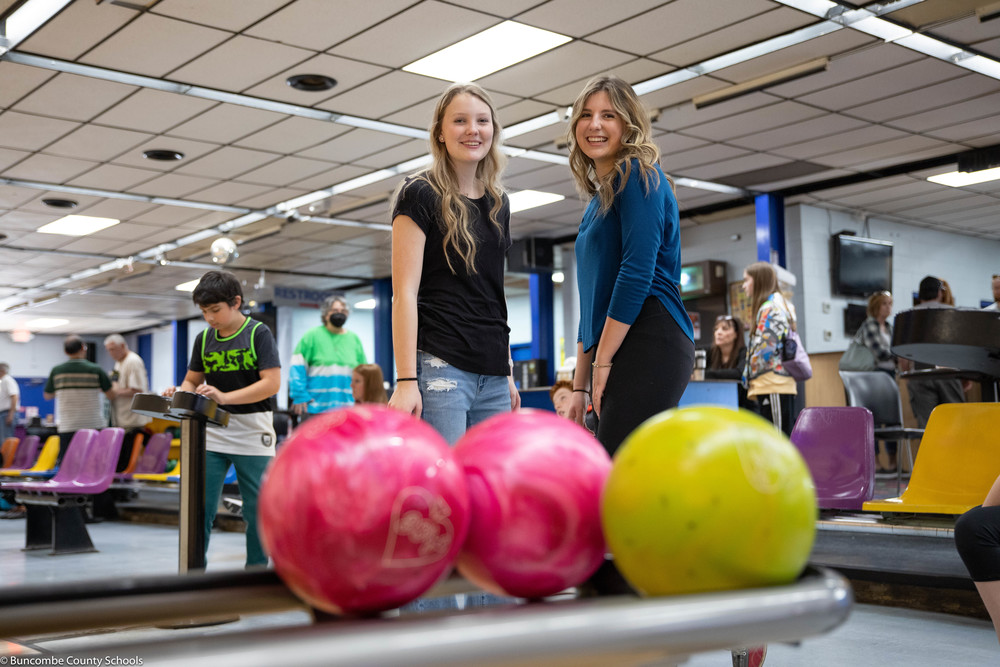 Students posing for a photo at the bowling alley