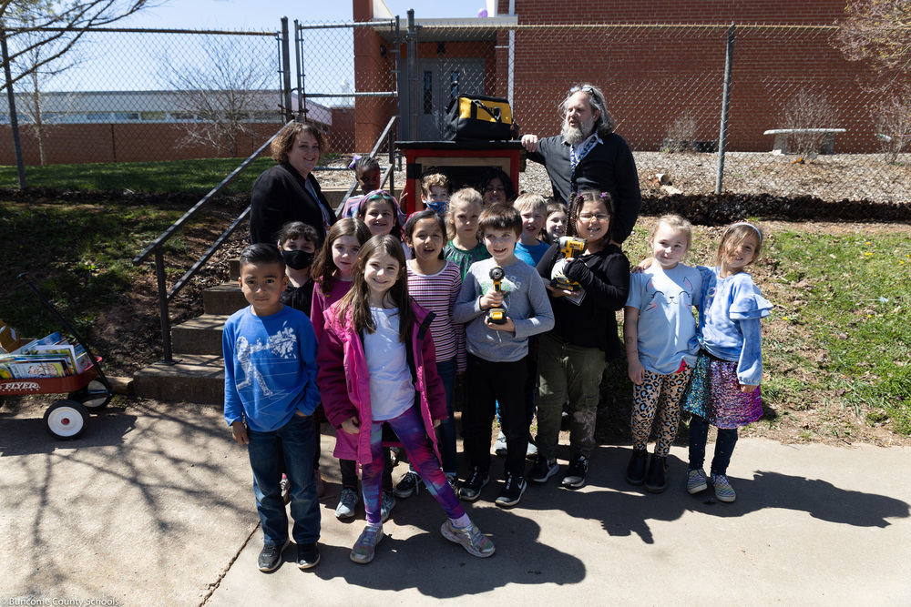 Students pose in front of new Little Library