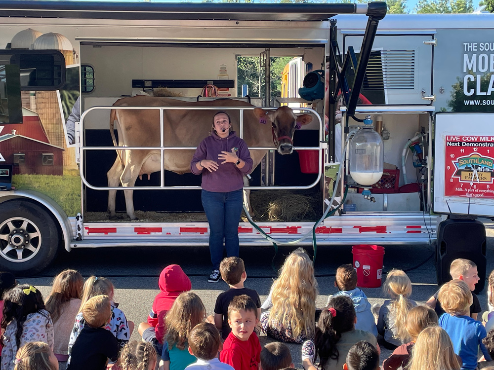 Dairy Lands Farm Mobile classroom doing a presentation with students