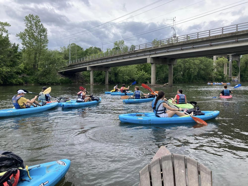 Students kayaking down the French Broad River. 