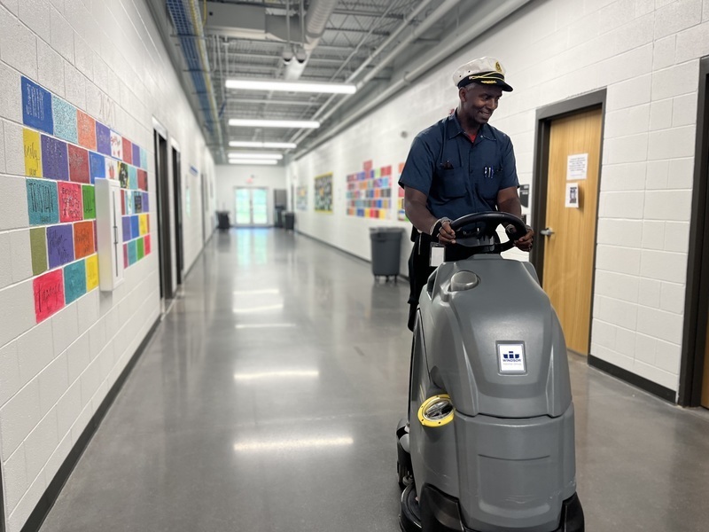 Captain Ray cleaning the halls of Community High. 