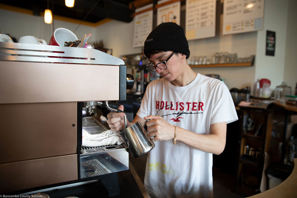 Juan working at High Five Coffee for his OneLife Internship