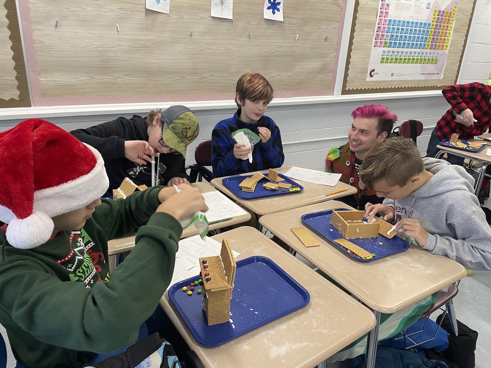 Students make gingerbread houses in math class