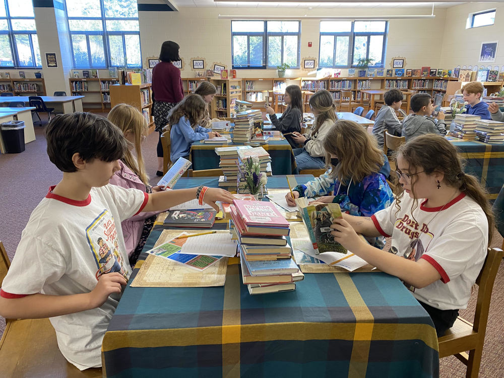 Students enjoying a book tasting in the Media Center.