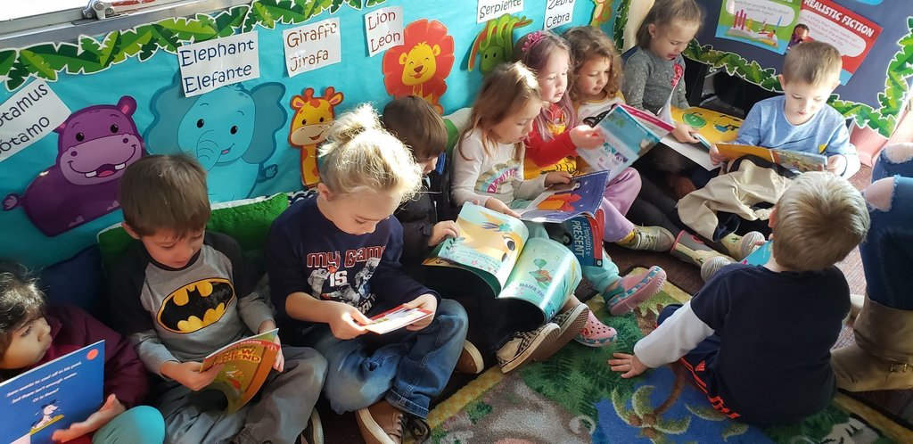 Students reading on the Buncombe County Schools Foundation Book Bus.