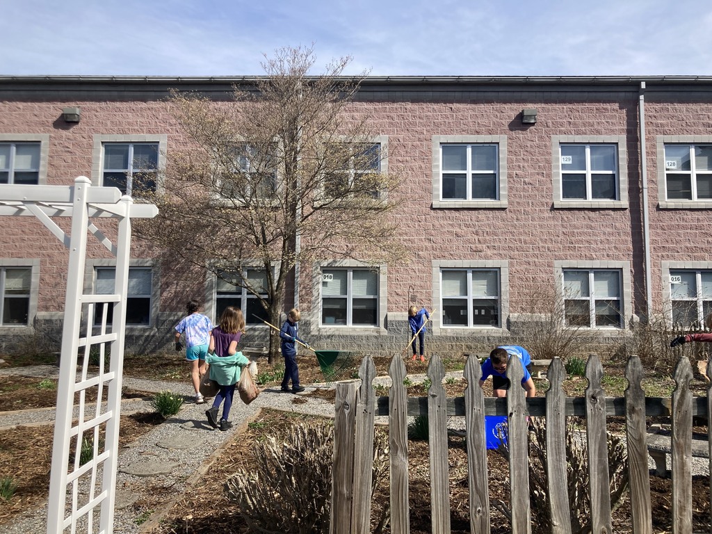 students mulching garden