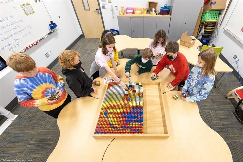 Students build Einstein Portrait out of rubik's cubes