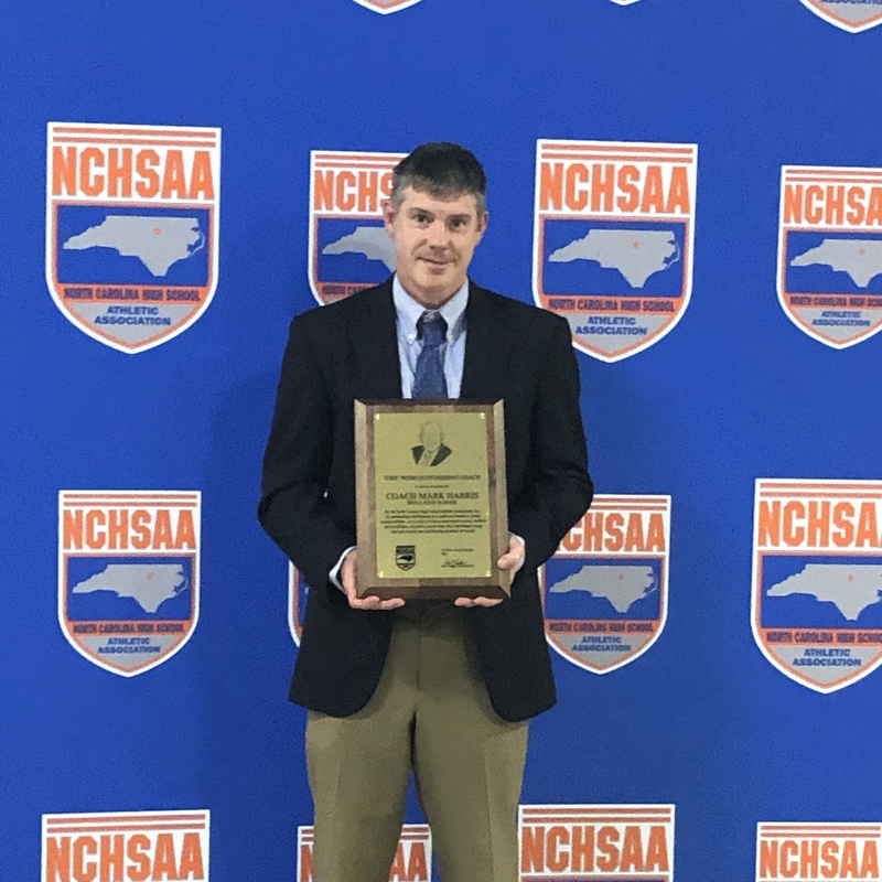 Coach Harris with his award