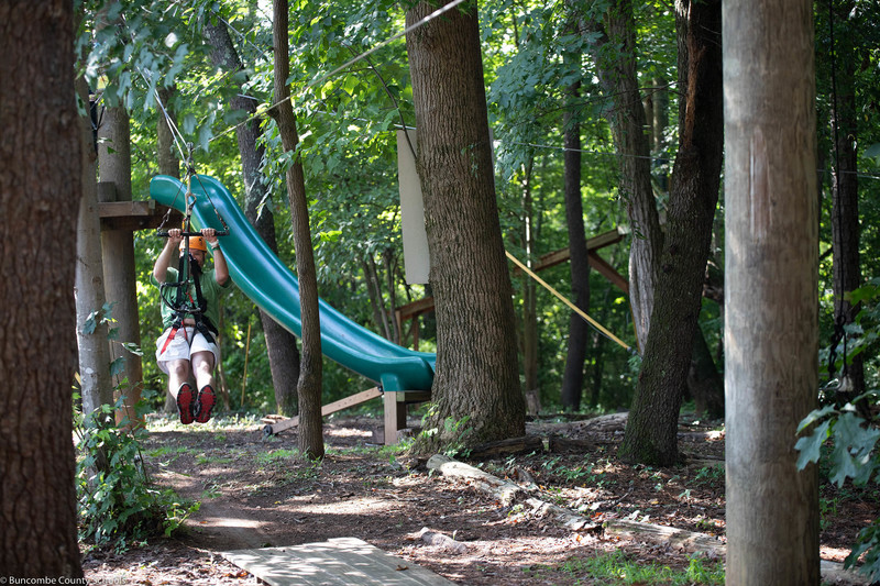 One of the teachers coming down the zipline