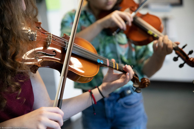 Students working on musical skills at the second annual Strings Summer Bash Camp.