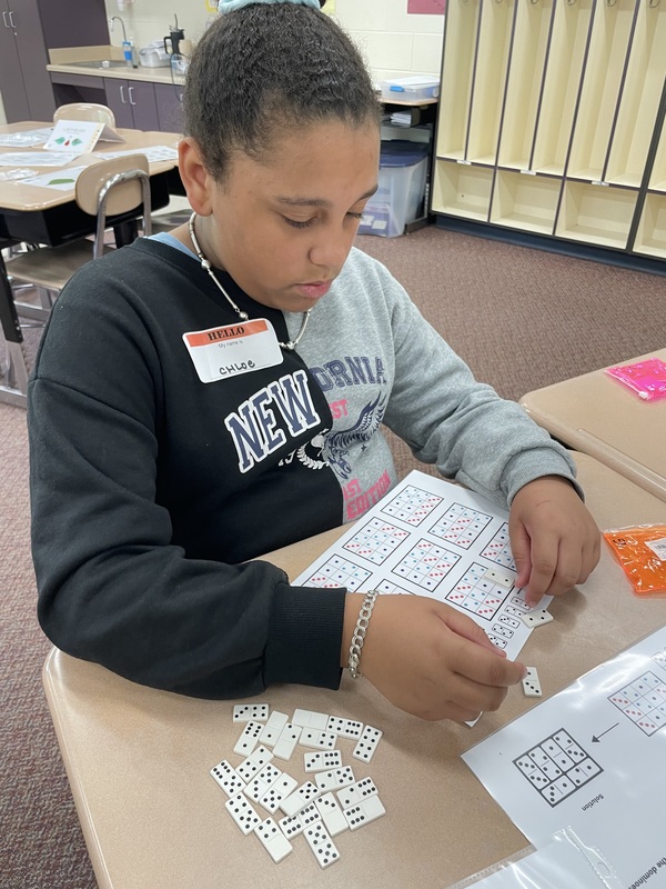 A student works on a math game.