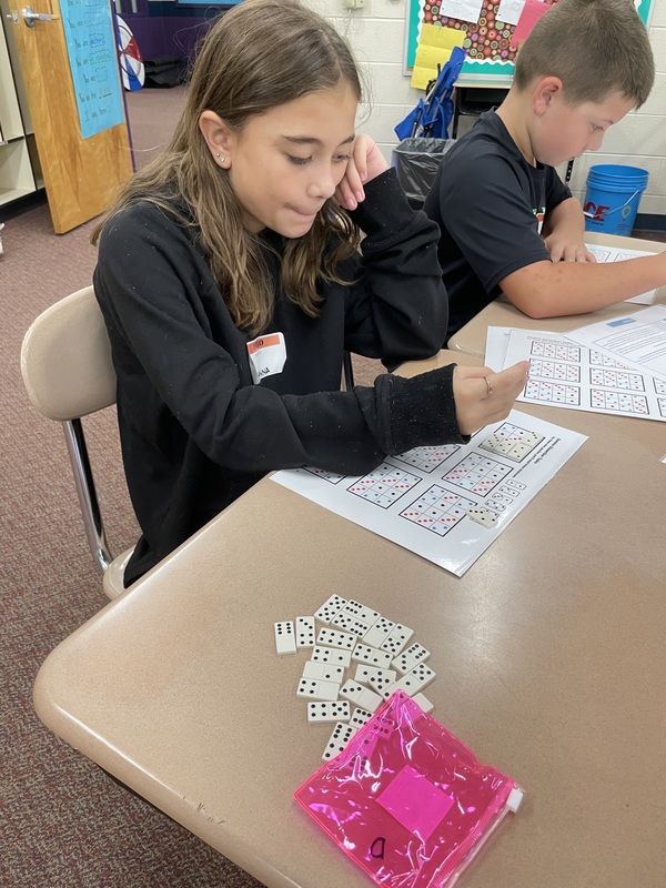 A student works on a math game.