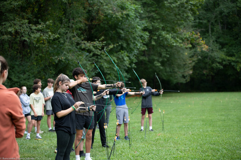 Students learning archery skills.