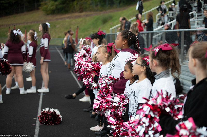 Youth cheerleaders cheering with the Owen High School cheerleaders. 