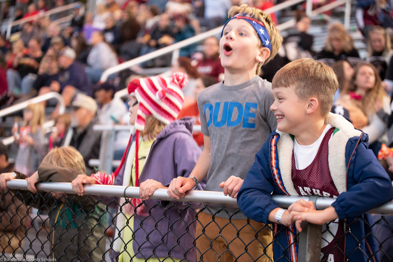 Students cheering on the Warhorse football team.