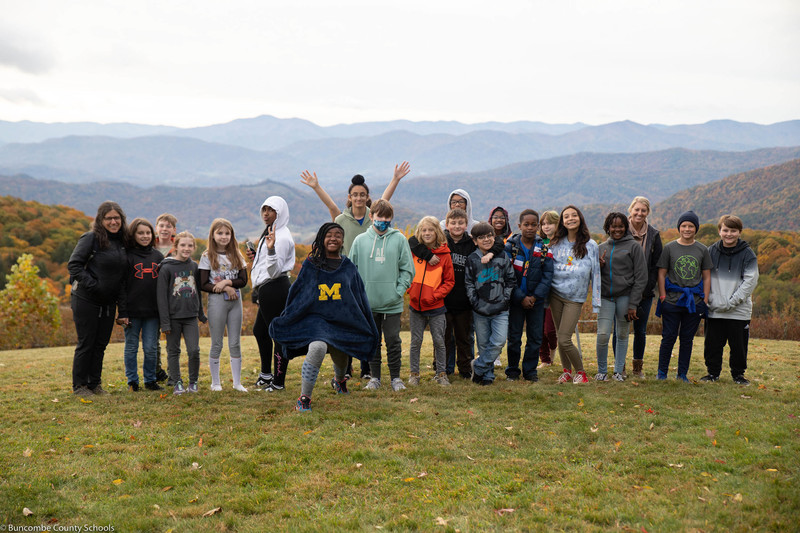Students and staff overlooking the valley that surrounds Purchase Knob.