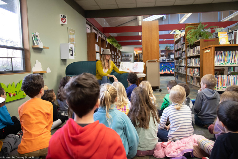 Students listen to a book reading at the Black Mountain Library.