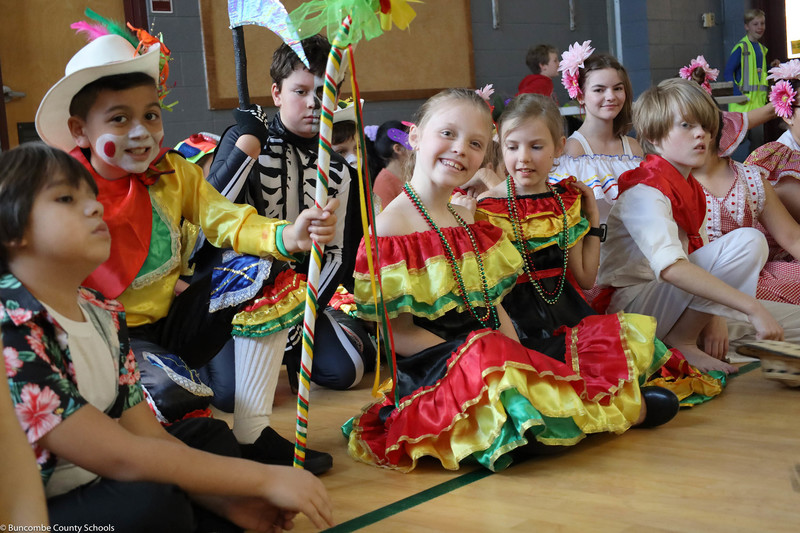 Students awaiting to perform, dressed in the colorful attire. 