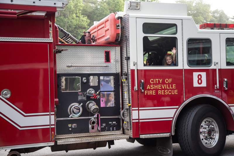 Student riding in a firetruck. 