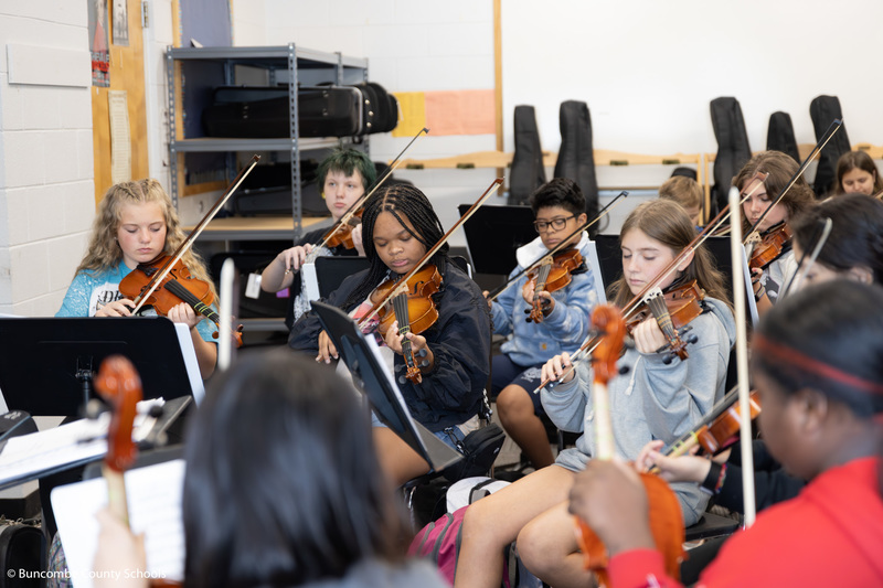Violinists playing during class at Valley Springs Middle School. 
